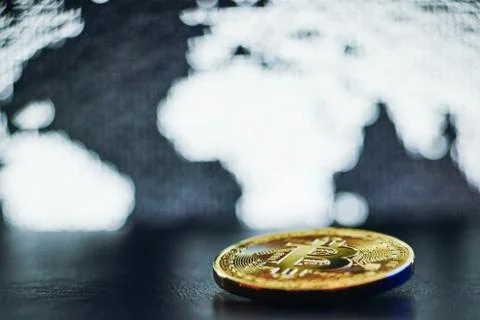 Bitcoin on world map background Stock Photos