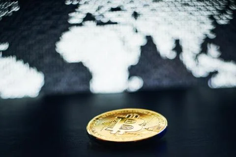 Bitcoin on world map background Foto stock