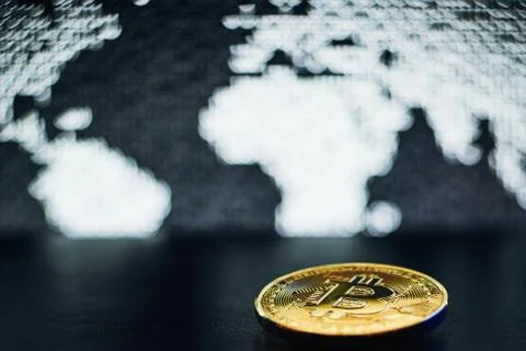 Bitcoin on world map background Stock Photos