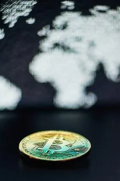 Bitcoin on world map background Stock Photos