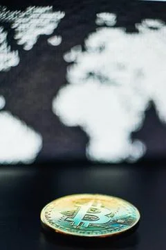 Bitcoin on world map background Stock Photos