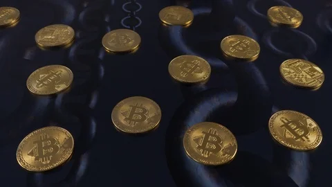 Bitcoins on an amimation of turning chains,  loop Stock Footage 87370463