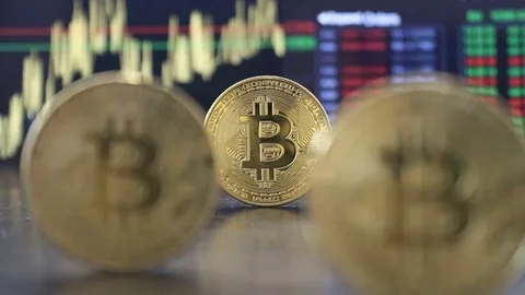 Bitcoins and digital ticker. HD Vidéo 128922484