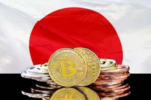 Bitcoins and the flag of Japan. Stock Photos