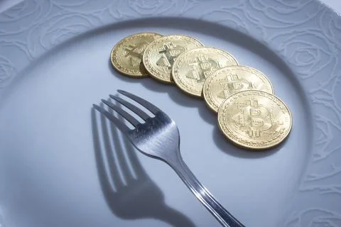 Bitcoins and fork Stock Photos