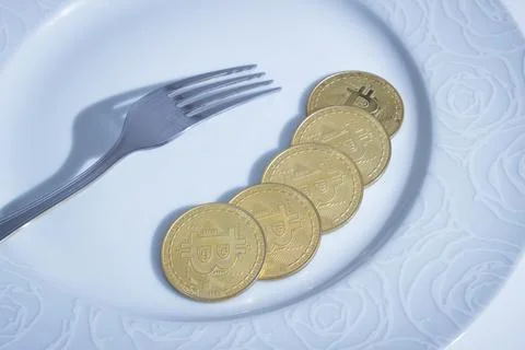Bitcoins and fork Stock Photos