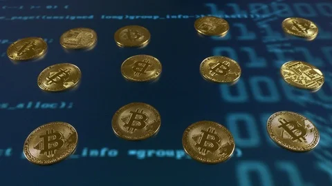 Bitcoins on an animation of computer code Stock Footage 87386593