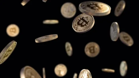 Bitcoins are falling on a black background with a depth of field Stock Footage 77429053