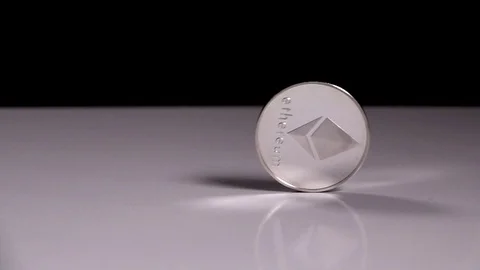 Bitcoins are falling on a black background. Slowmotion shot tossing bitcoin Stock-Footage 115943831