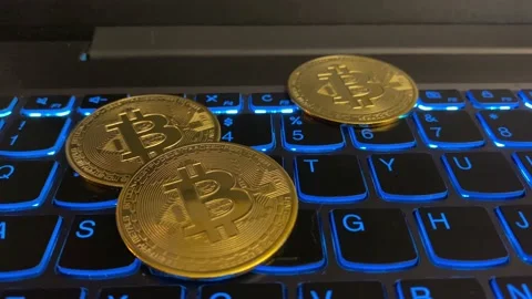 Bitcoins on Computer Keyboard Stock Footage 159359508