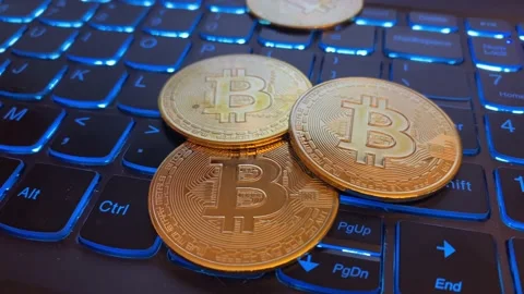 Bitcoins on Computer Keyboard Stock Footage 159359654