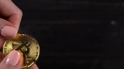 Bitcoins exchange between men and woman hand Stock Footage 87215015