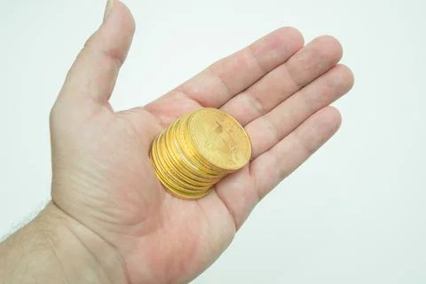 Bitcoins in hand Stock Photos