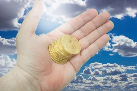 Bitcoins in hand Stock Photos