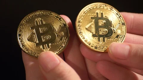 Bitcoins in the hands Stock Footage 86096820