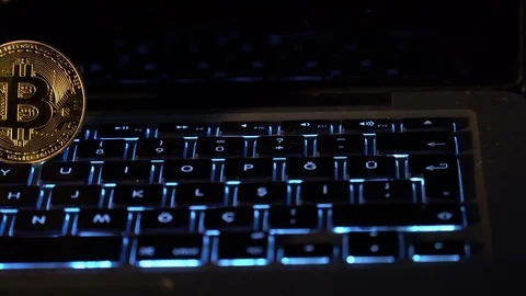 Bitcoins on Keyboard Stock Footage 119254939