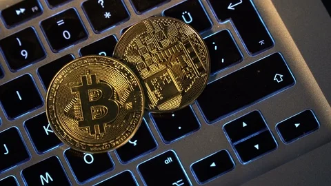 Bitcoins on Keyboard Stock Footage 119255545