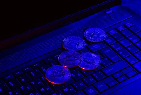 Bitcoins on a laptop Stock Photos