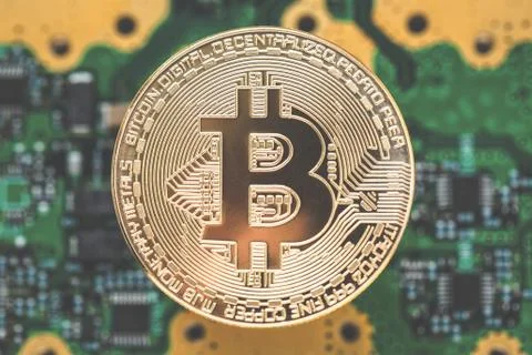Bitcoins  on the microchip background with tone effect. Physical bit coin Stock Photos