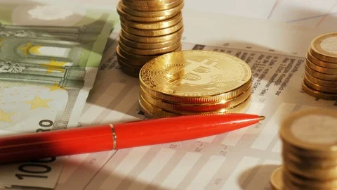 Bitcoins on an office table while filling out the tax declaration Stock Footage 86416737