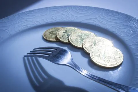 Bitcoins in plate Stock Photos