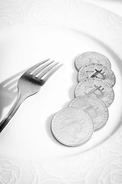 Bitcoins in plate Stock Photos