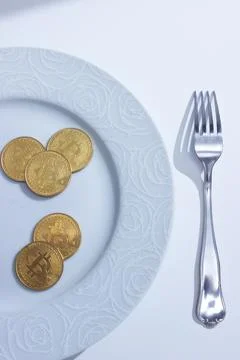 Bitcoins in plate Stock Photos