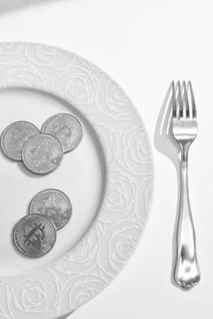 Bitcoins in plate Stock Photos