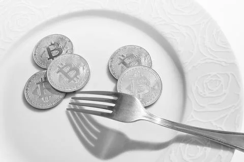 Bitcoins in plate Stock Photos