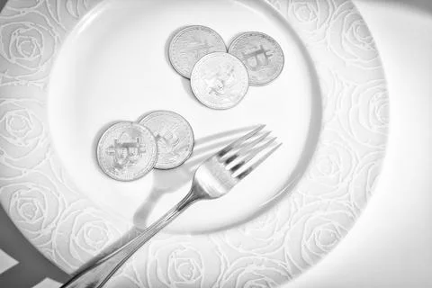 Bitcoins in plate Stock Photos