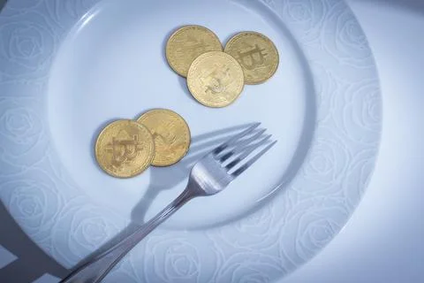 Bitcoins in plate Stock Photos