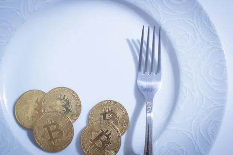 Bitcoins in plate Stock Photos