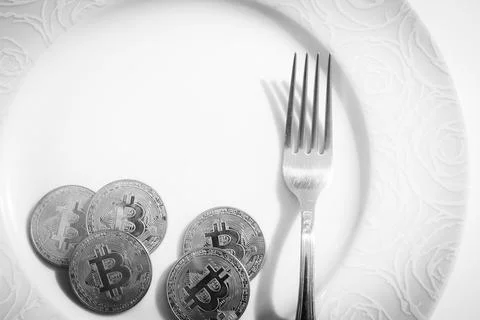 Bitcoins in plate Stock Photos
