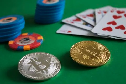 Bitcoins on poker table Stock Photos