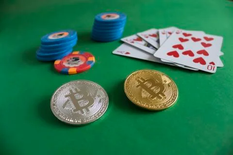 Bitcoins on poker table Stock Photos
