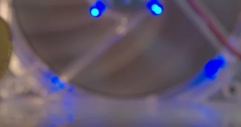 Bitcoins rolling with GPU running on the background symbolizing a Bitcoin mining Stock Footage 114781175