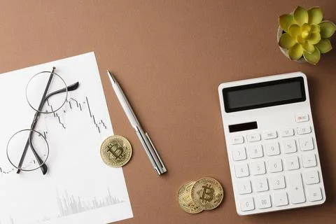 Bitcoins with stock chart. Flat lay Stock Photos