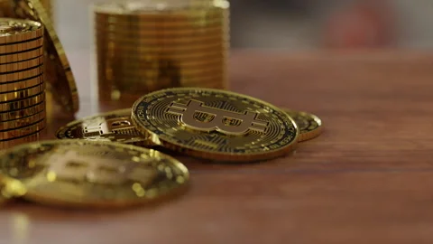 Bitcoins on the wooden table Stock Footage 253588822