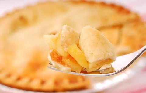 Bite of apple pie on a fork Foto stock