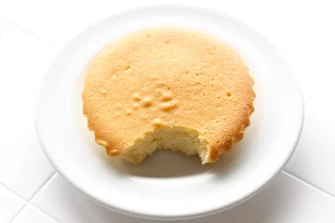 Bite in butter cake Stock Photos