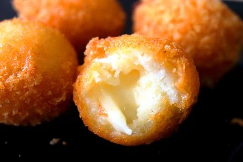 Bite cheese ball. Stock Photos