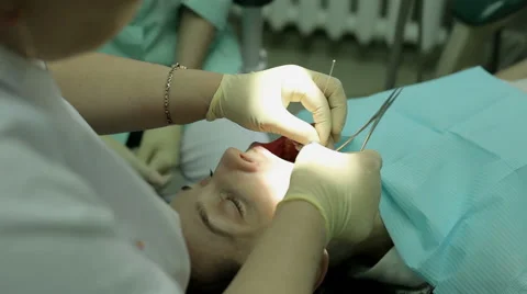 Bite correction. Orthodontist at work. The young woman visiting the orthodontist Stock-Footage 63763518