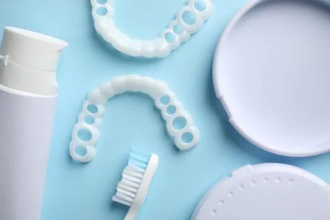 Bite correction. Toothpaste, brush, container and dental mouth guards on li.. Stock Photos