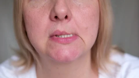 Bite lower lip Headshot of frustrated stressed Caucasian woman biting lower lip Stock Footage 287440787
