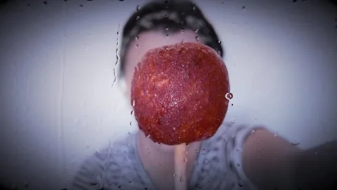 BITE MANZANA Candy Apple chewing Stock Footage 136069052