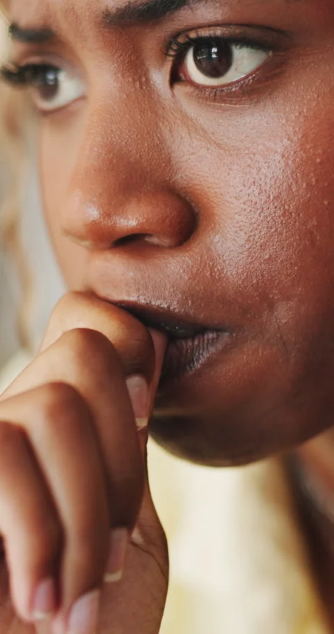 Bite, nails and woman with depression, anxiety and mental health from Stock Footage 333086538