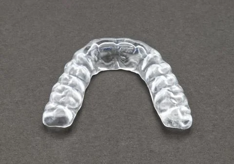 Bite plate to protect teeth at night from grinding. Mobile orthodontic appl.. Stock-Fotos
