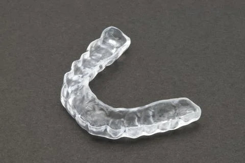 Bite plate to protect teeth at night from grinding. Mobile orthodontic appl.. Stock Photos