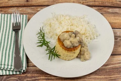 Bite to the queen and rice, close-up, on a plate Stock Photos