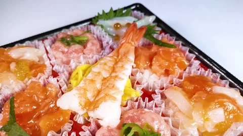 Bite-sized Seafood Chirashi Sushi close up, rotating Stock Footage 327051293